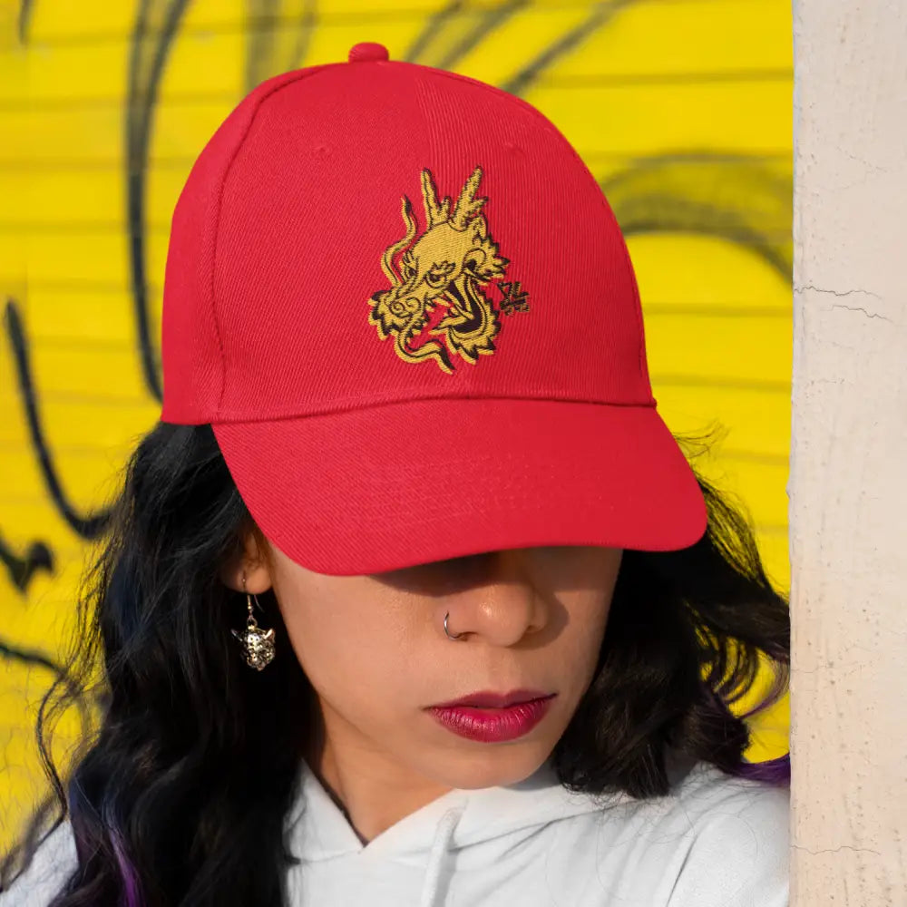Red cap with dragon embroidery, celebrating Bruce Lee’s 85th Anniversary logo