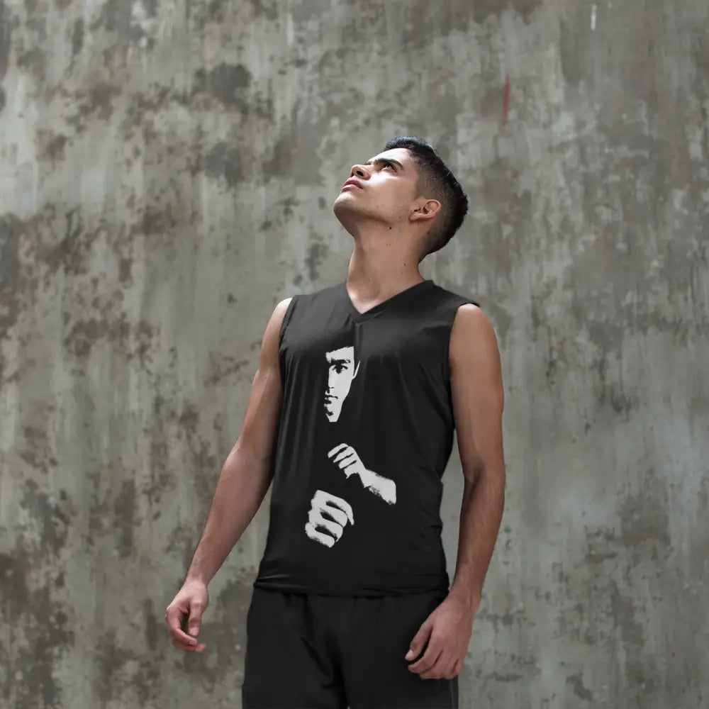 Person in Bruce Lee Out of Darkness Tank looking upward with martial arts design