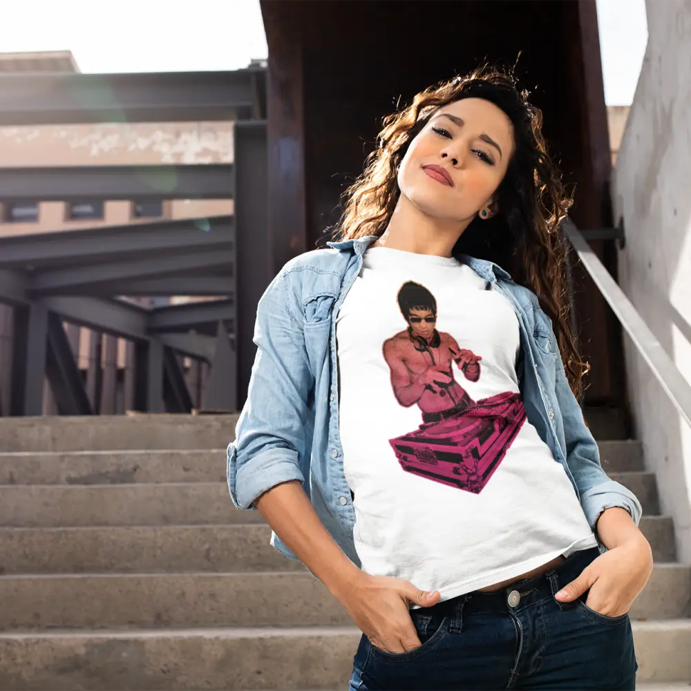 Woman in denim jacket and graphic DJ Bruce Multicolour T-Shirt featuring Bruce Lee, posing on stairs