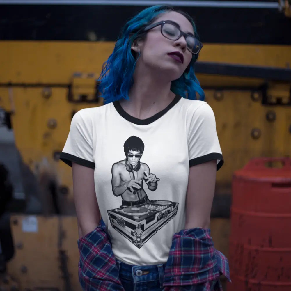 Person with blue hair in DJ Bruce Outline Ringer T-Shirt featuring Bruce Lee graphic