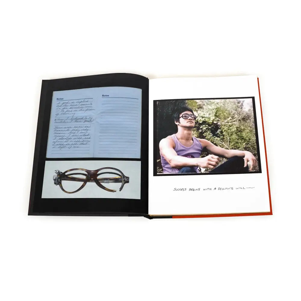 Open book with photographs and notes from Bruce Lee’s journey in martial arts