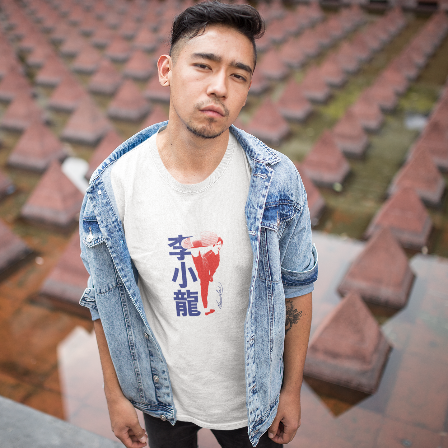 Young man in denim jacket with Bruce Lee Kick Signature T-Shirt in white